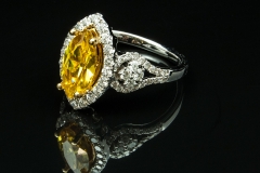 Canary diamond ring with diamond side stones set in 14kw